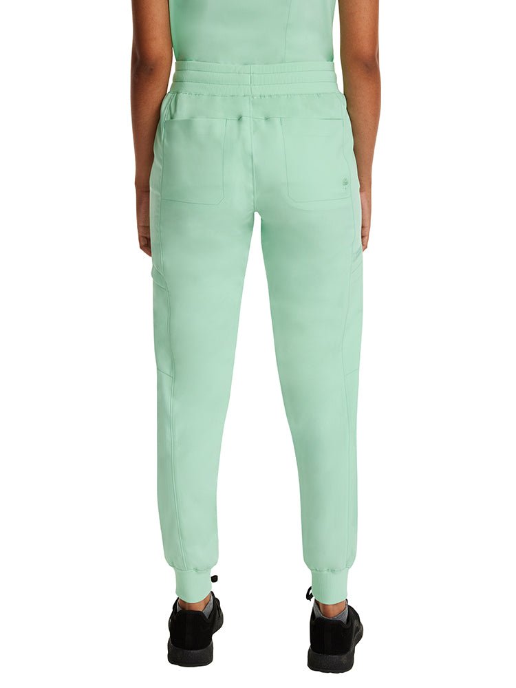 Young female healthcare professional wearing a Purple Label by Healing Hands Women's Toby Jogger in Cool Mint with a contrast stripe drawstring.