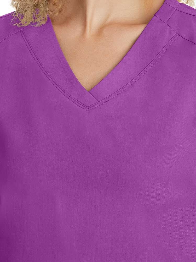 Purple Label Women's Jill V-Neck Scrub Top in Crush Berry has an overlapping v-neck line