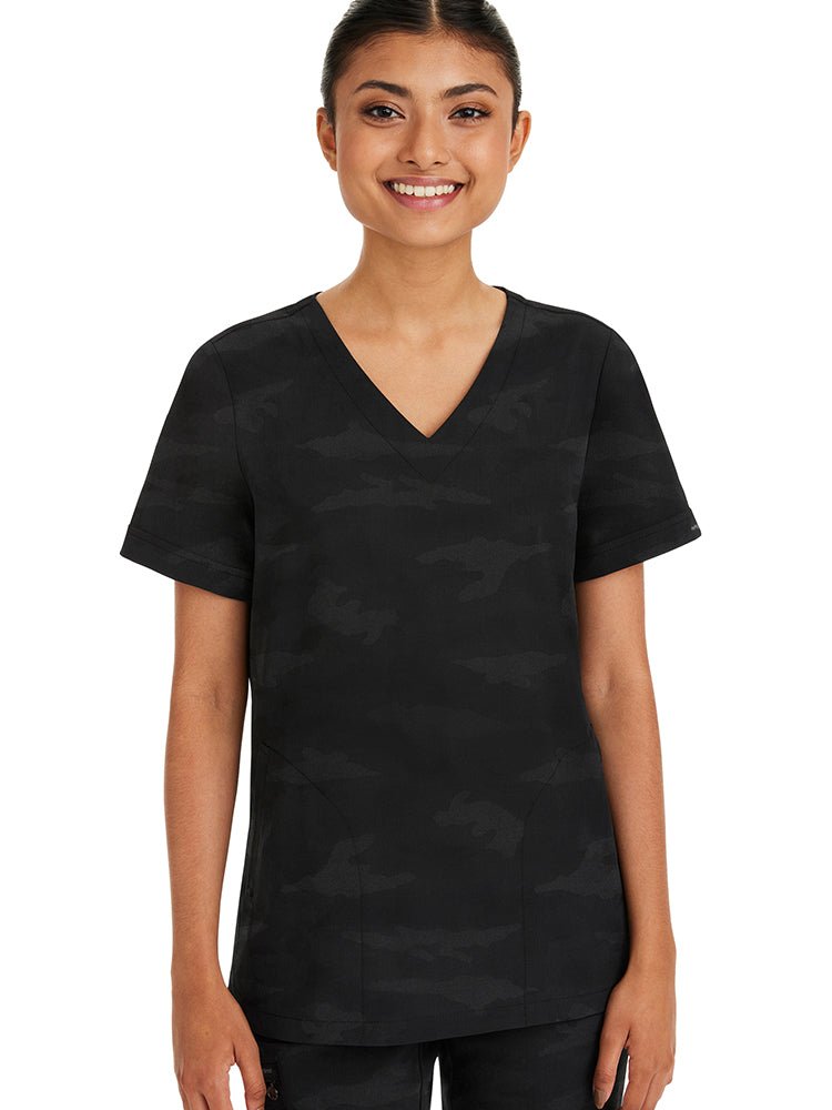 Young woman wearing a Purple Label Women's Joy Camo Top in black featuring a v-neckline.