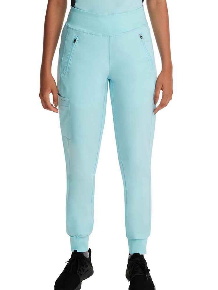 Female healthcare professional wearing a pair of Purple Label Women's Tara Jogger Scrub Pants in "Seabrook" featuring a cargo pocket on the wearer's right leg.