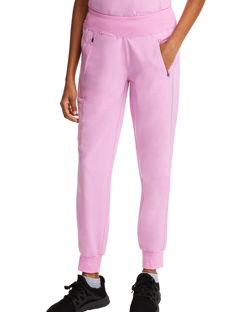 Female nurse wearing a pair of Women's Tara Jogger Scrub Pants from Purple Label by Healing Hands.