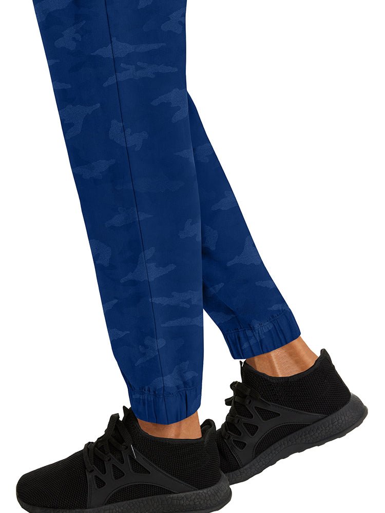 Nurse wearing a pair of Purple Label Women's Tate Camo Joggers in Navy with unique, quick drying fabric.