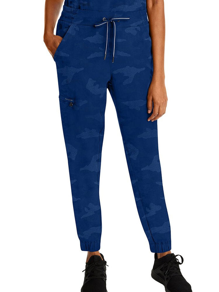 Young woman wearing a pair of Purple Label Women's Tate Camo Joggers in Navy featuring a modern fit.