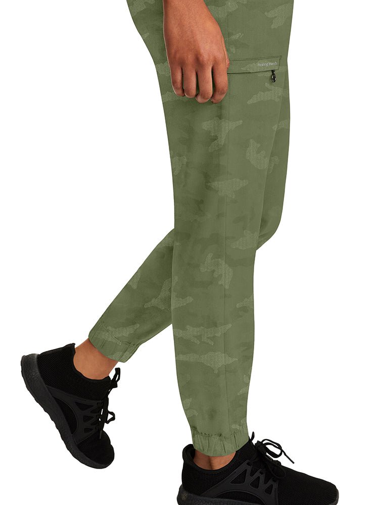 Nurse wearing a pair of Purple Label Women's Tate Camo Joggers in Olive with unique, quick drying fabric.