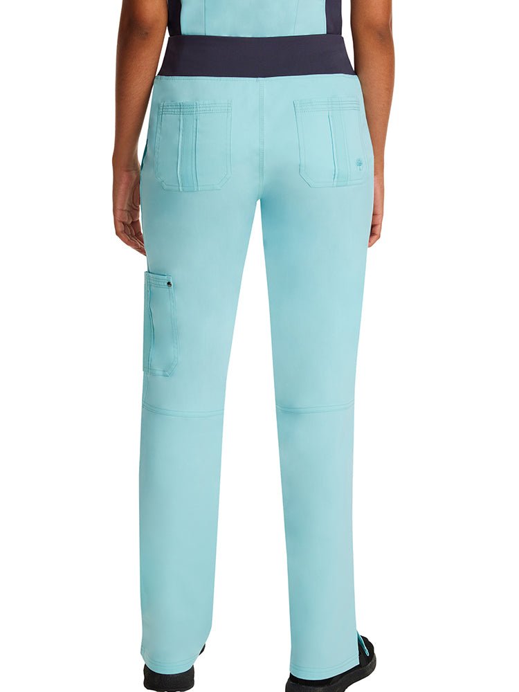 Female healthcare professional wearing a pair of Purple Label Women's Tori Yoga Scrub Pants in "Seabrook" featuring a "yoga" knit waistband.