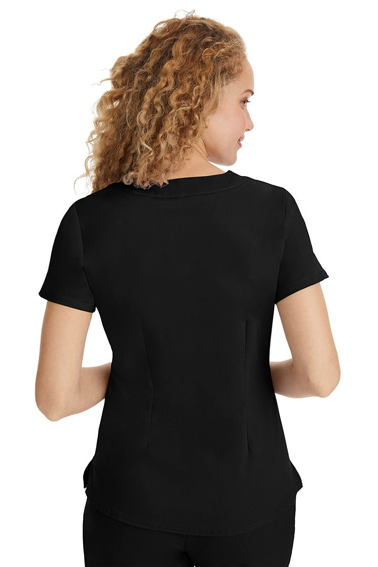 A young LPN wearing a Purple Label Women's Jane V-Neck Scrub Top in Black featuring a medium center back length of 26.5".