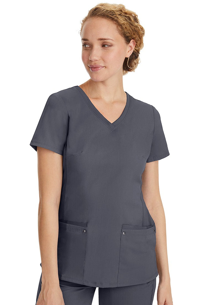 A lady nurse wearing a Purple Label Women's Juliet Yoga Scrub Top in Pewter featuring a super comfortable stretch fabric made of 77% polyester/20% rayon/3% spandex.