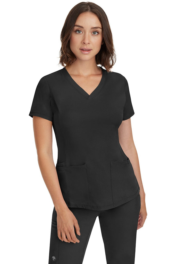 A female Nurse Practitioner wearing an HH-Works Women's Monica Multi-Pocket Scrub Top in Black featuring a total of 4 pockets.