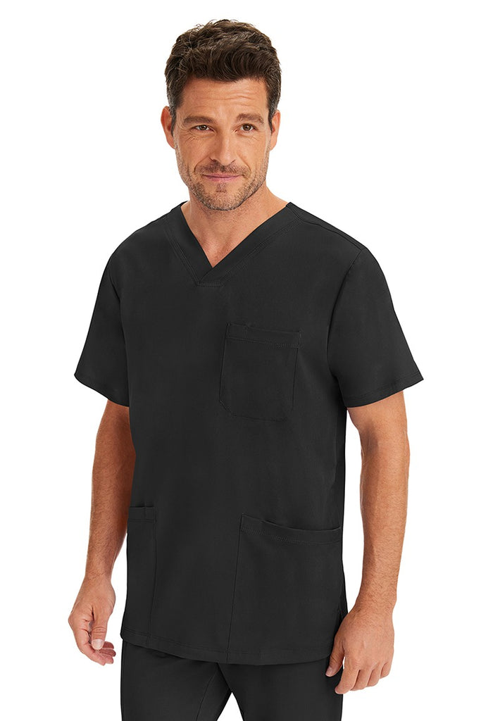 A male LPN wearing an HH-Works Men's Matthew V-Neck Scrub Top in Black featuring a unique 4 way stretch fabric.