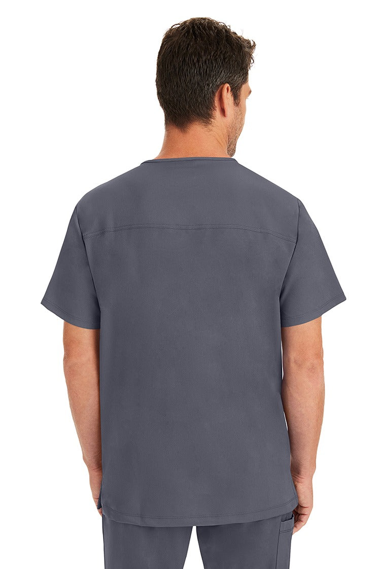 A male LPN wearing a Men's Matthew V-Neck Scrub Top from HH Works in Pewter featuring a center back length of 28".