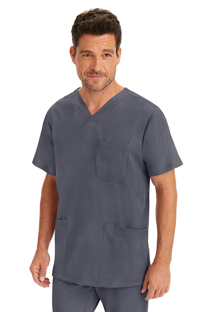 A male LVN wearing an HH-Works Men's Matthew V-Neck Scrub Top in Pewter featuring a unique 4 way stretch fabric.