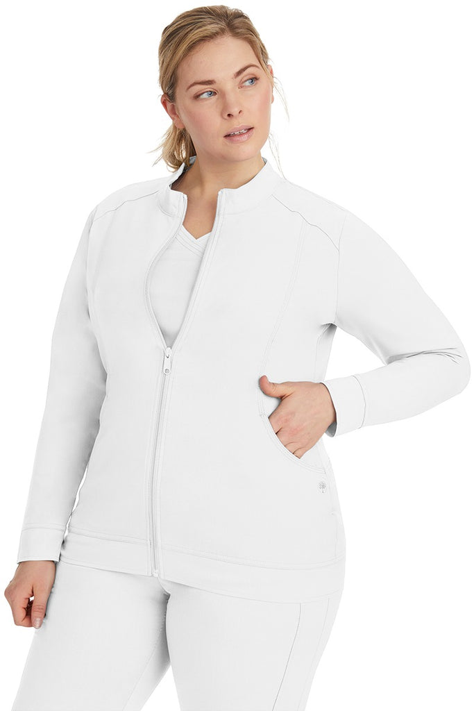 A young LPN wearing a Purple Label Women's Dakota Zip Up Scrub Jacket in White featuring a super comfortable fabric made of 77% Polyester/20% Rayon/3% Spandex.