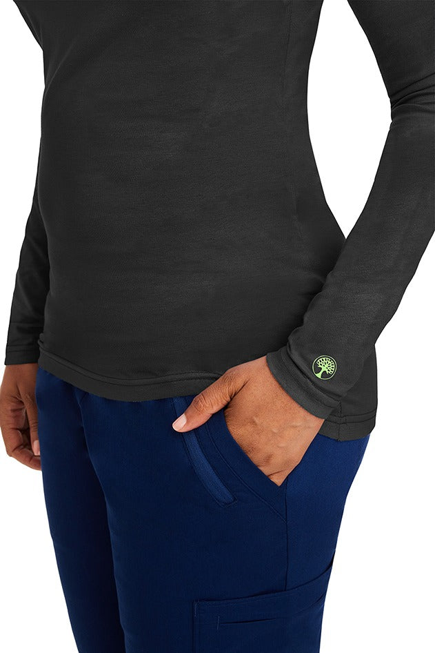 A female clinical nurse specialist wearing a Purple Label Women's Melissa Long Sleeve T-Shirt in Black featuring a unique fabric made of 57% Cotton, 38% Polyester & 5% Spandex.