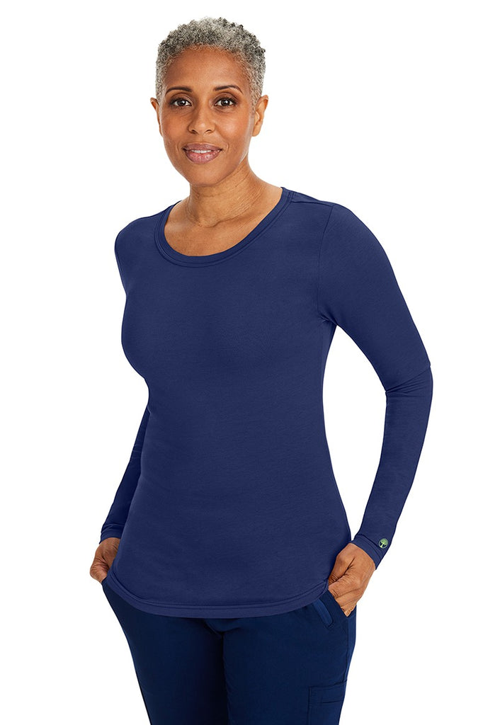A lady CNA wearing a Purple Label Women's Melissa Long Sleeve T-Shirt in Navy featuring a slim fit to provide a flattering all day look.