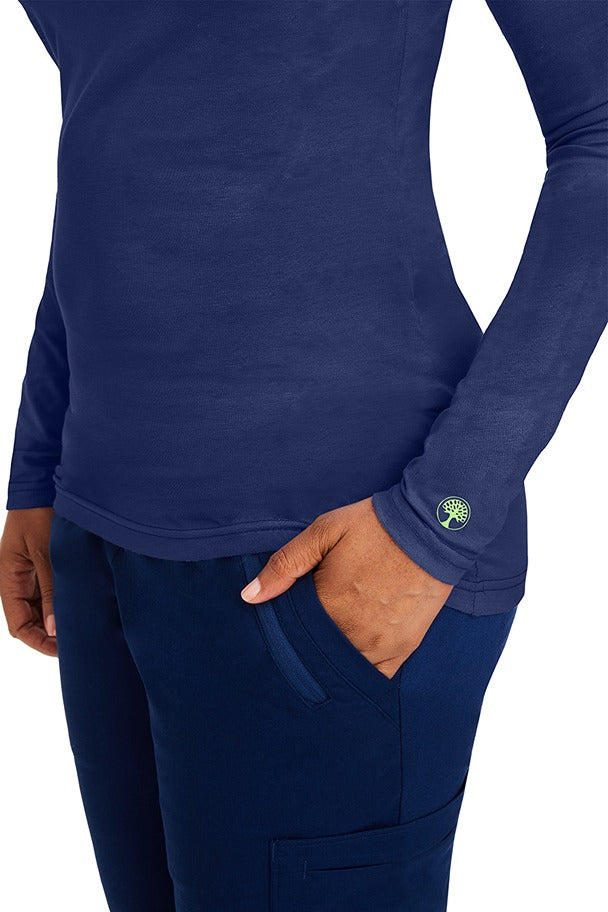 A female clinical nurse specialist wearing a Purple Label Women's Melissa Long Sleeve T-Shirt in Navy featuring a unique fabric made of 57% Cotton, 38% Polyester & 5% Spandex.