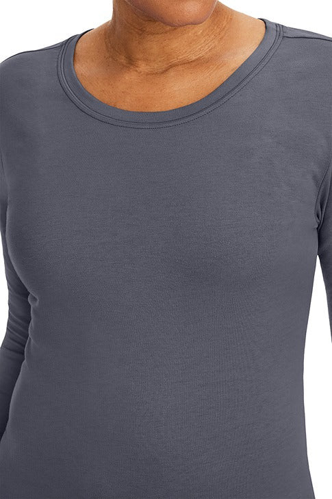 A lady nurse practitioner wearing a Purple Label Women's Melissa Long Sleeve T-Shirt from Healing Hands in Pewter featuring a super comfortable fabric blend that resists wrinkles, shrinking, and fading better than traditional cotton scrubs.