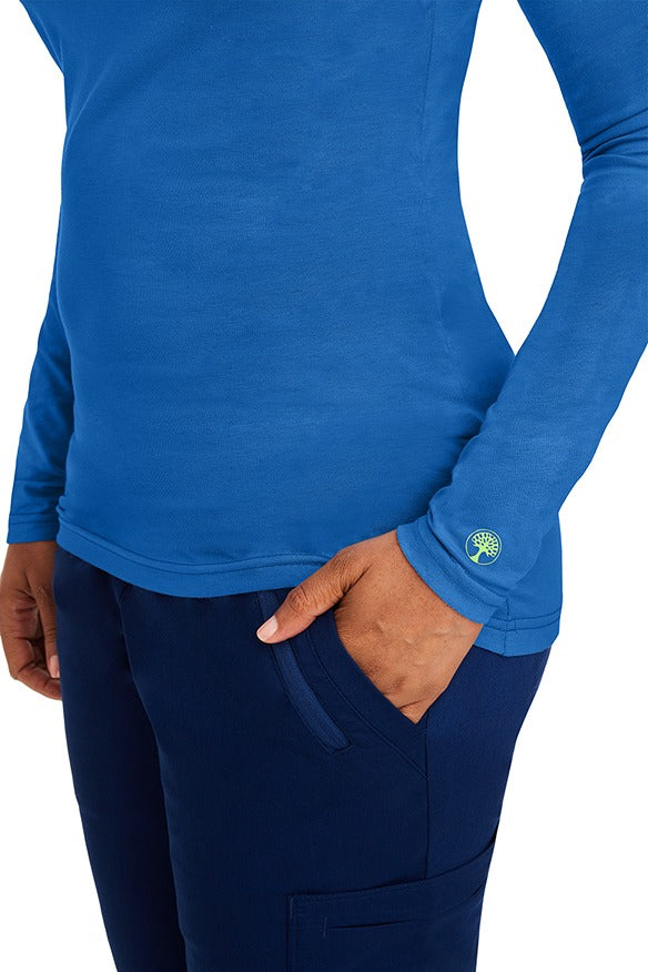 A female clinical nurse specialist wearing a Purple Label Women's Melissa Long Sleeve T-Shirt in Royal featuring a unique fabric made of 57% Cotton, 38% Polyester & 5% Spandex.