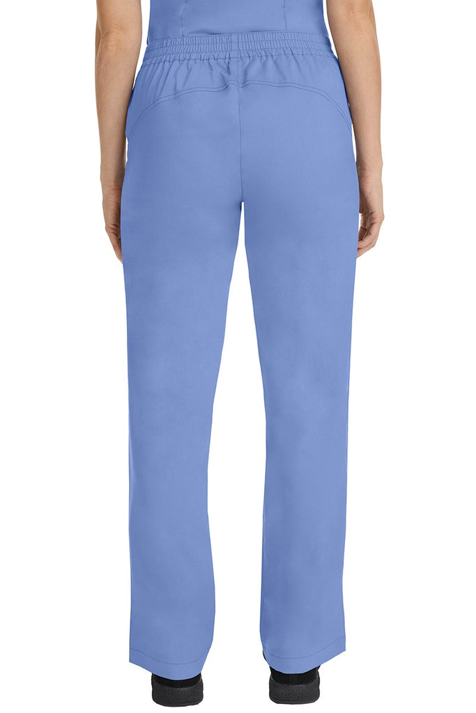 A female CNA wearing a pair of Purple Label Women's Taylor Drawstring Scrub Pants in Ceil featuring a back yoke to ensure comfortable & flattering all day fit.