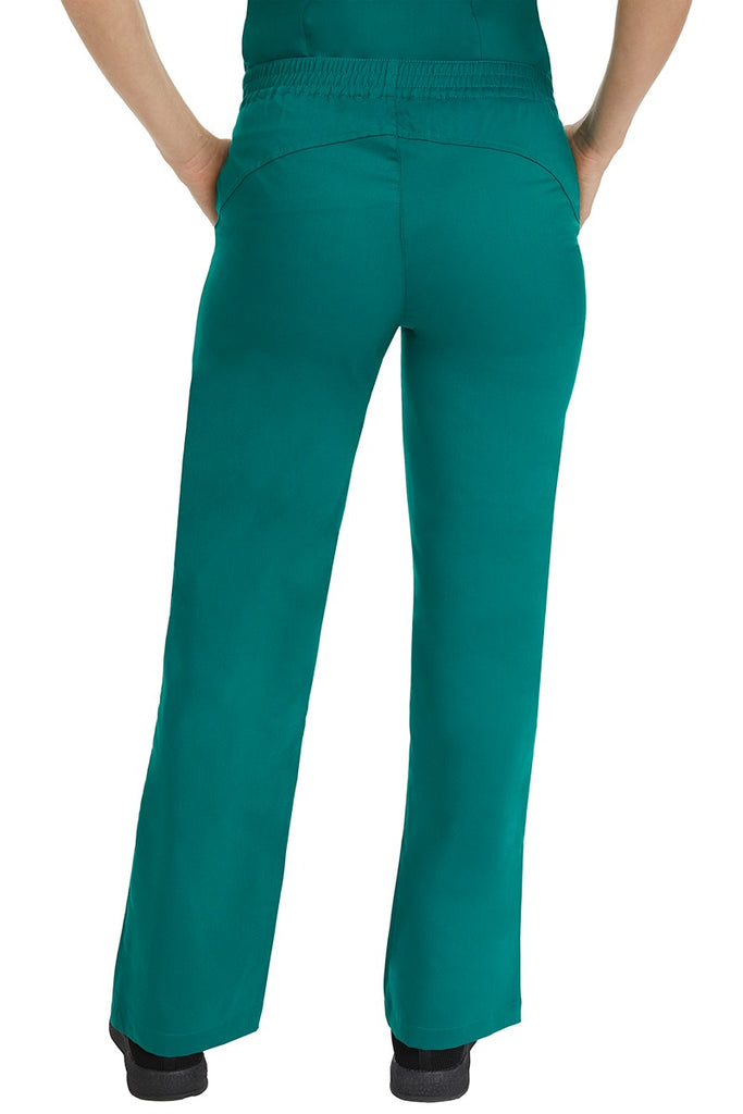 A female CNA wearing a pair of Purple Label Women's Taylor Drawstring Scrub Pants in Hunter Green featuring a back yoke to ensure comfortable & flattering all day fit.