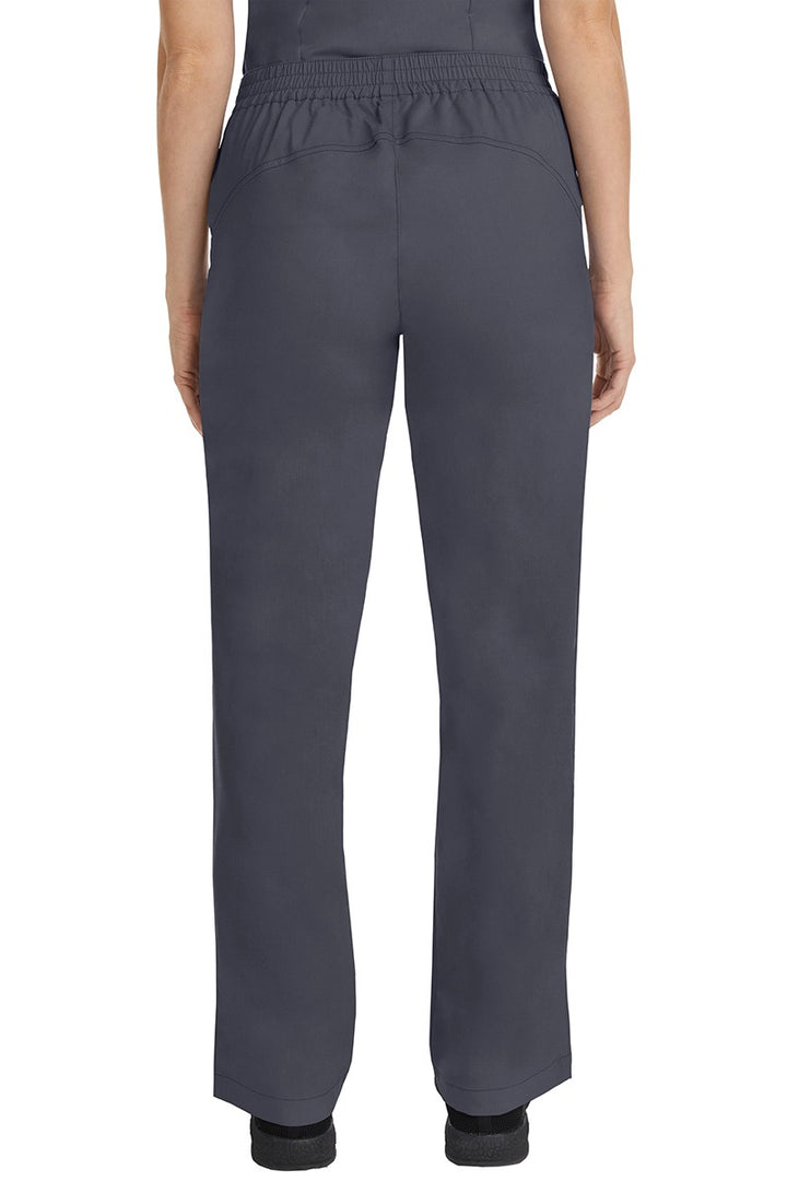 A female CNA wearing a pair of Purple Label Women's Taylor Drawstring Scrub Pants in Pewter featuring a back yoke to ensure comfortable & flattering all day fit.
