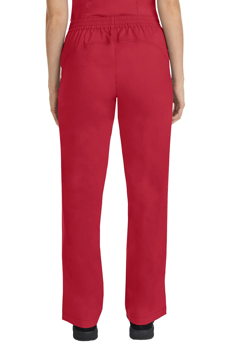 A female CNA wearing a pair of Purple Label Women's Taylor Drawstring Scrub Pants in Red featuring a back yoke to ensure comfortable & flattering all day fit.