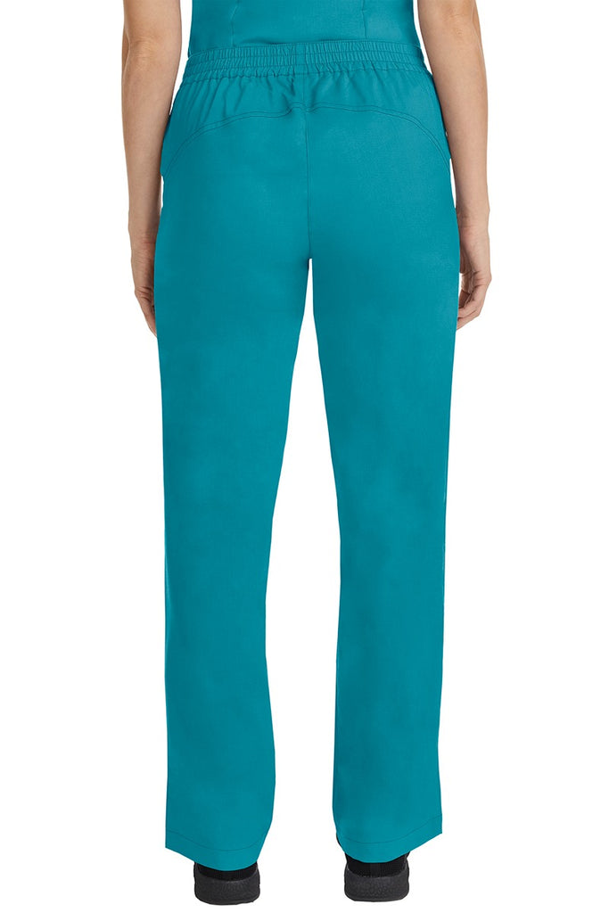 A female CNA wearing a pair of Purple Label Women's Taylor Drawstring Scrub Pants in Teal featuring a back yoke to ensure comfortable & flattering all day fit.