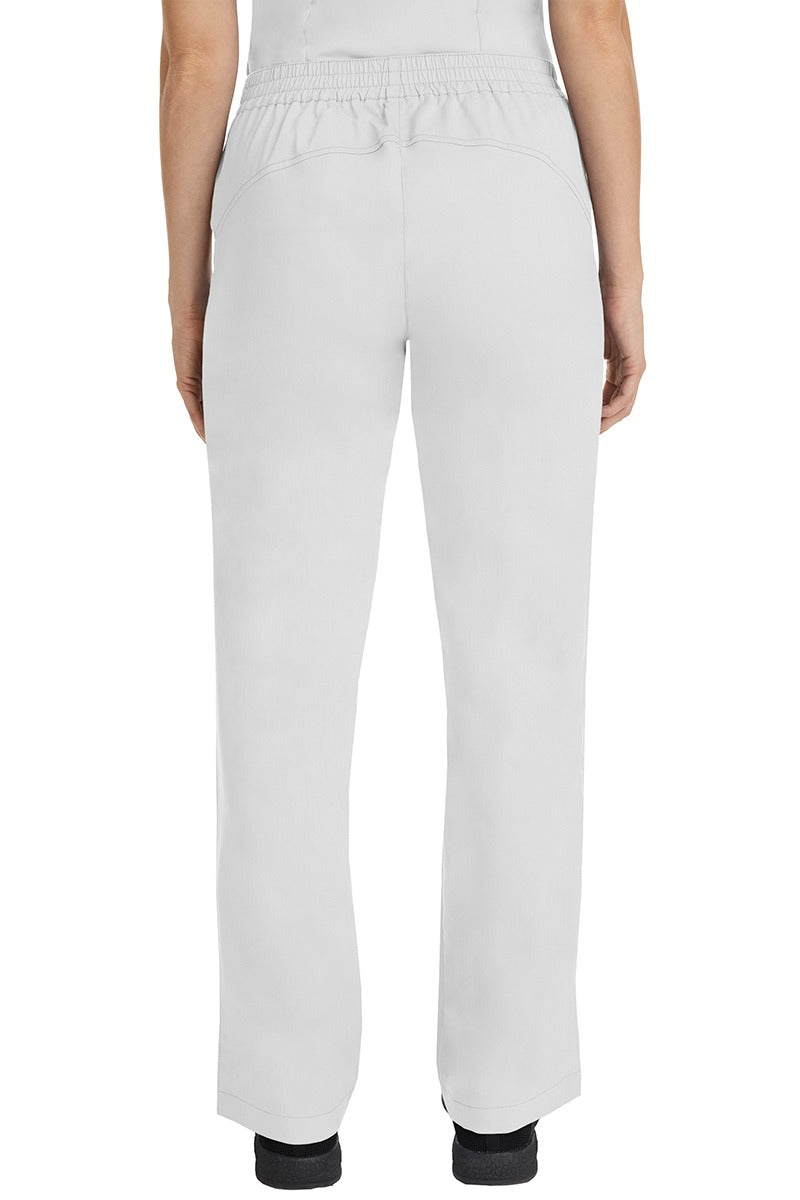 A female CNA wearing a pair of Purple Label Women's Taylor Drawstring Scrub Pants in White featuring a back yoke to ensure comfortable & flattering all day fit.