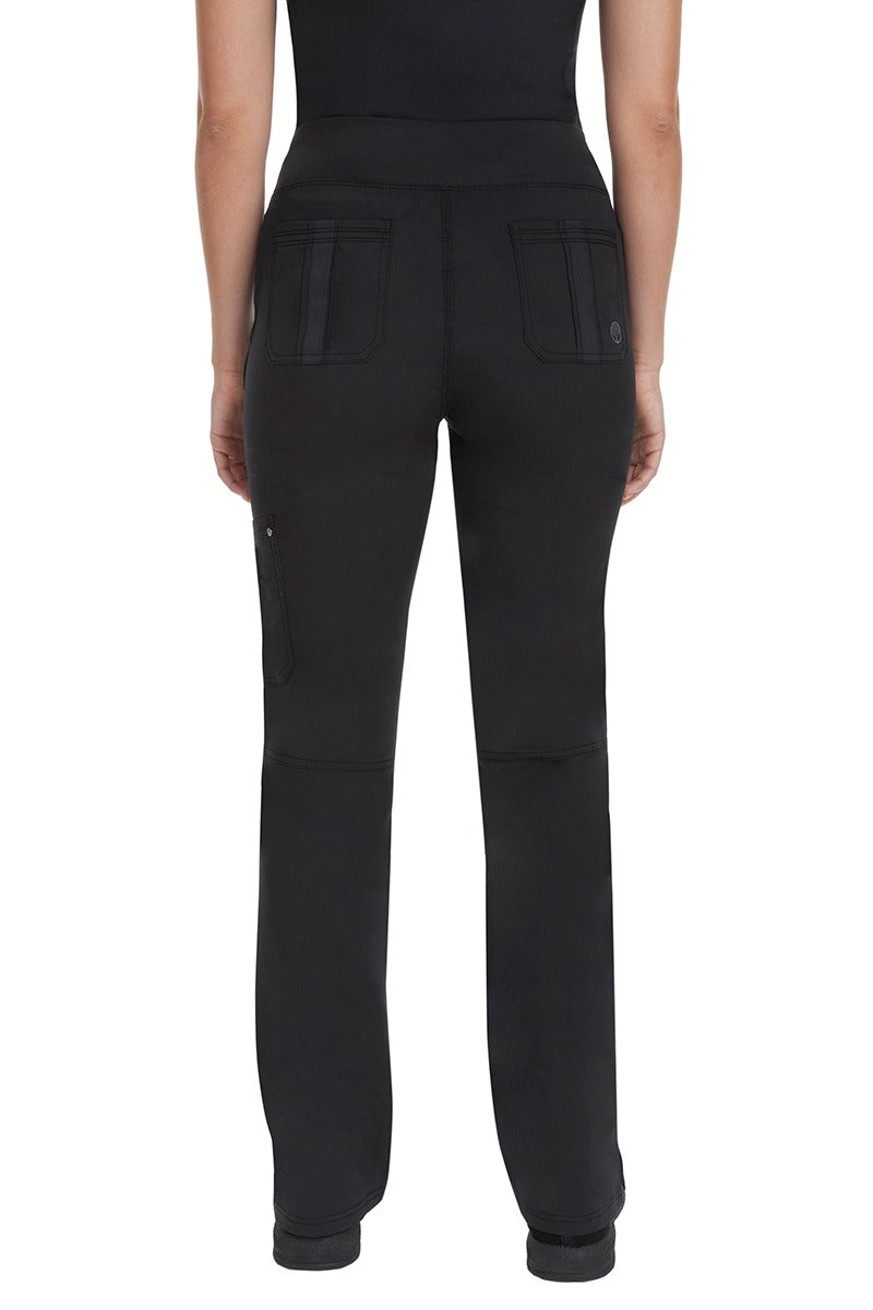 A lady CNA wearing a pair of  Women's Tori Yoga Waistband Scrub Pants from Purple Label in Black featuring 2 back patch pockets for additional on the job storage room.