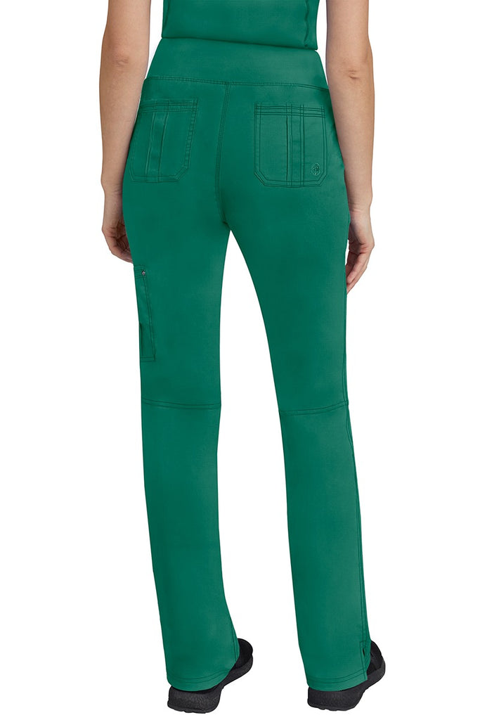 A lady CNA wearing a pair of Women's Tori Yoga Waistband Scrub Pants from Purple Label in Hunter Green featuring 2 back patch pockets for additional on the job storage room.