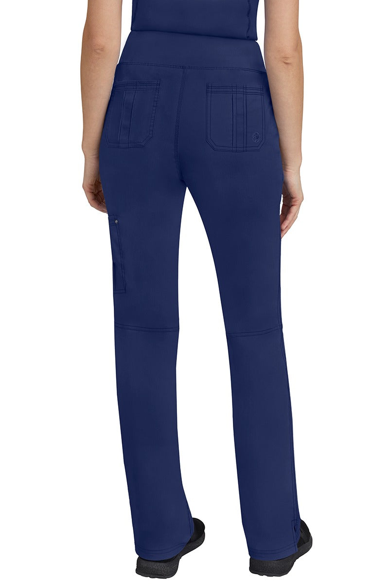 A lady CNA wearing a pair of Women's Tori Yoga Waistband Scrub Pants from Purple Label in Navy featuring 2 back patch pockets for additional on the job storage room.