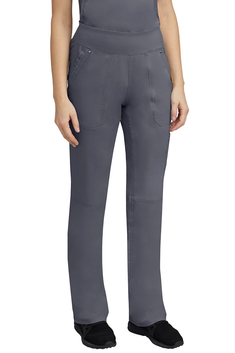 A young woman wearing a Purple Label Women's Tori Yoga Waistband Scrub Pant in Pewter featuring a yoga knit waistband.