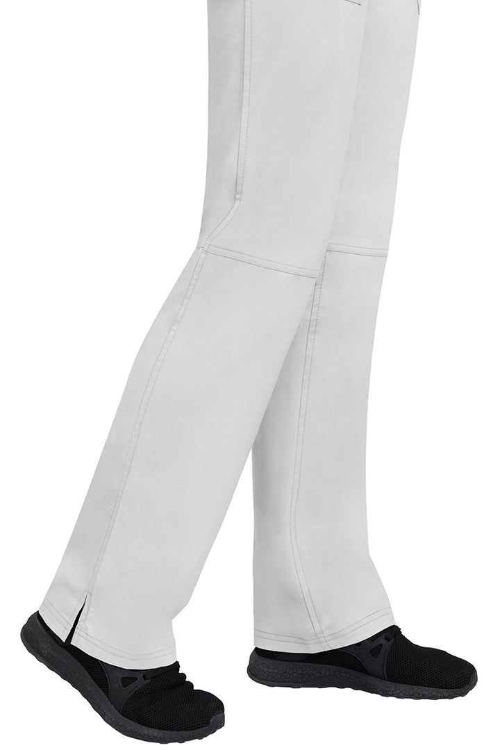 A young woman wearing a pair of Purple Label Women's Tori Yoga Waistband Scrub Pants in White featuring a fabric made of 77% Polyester/ 20% Rayon/ 3% Spandex.
