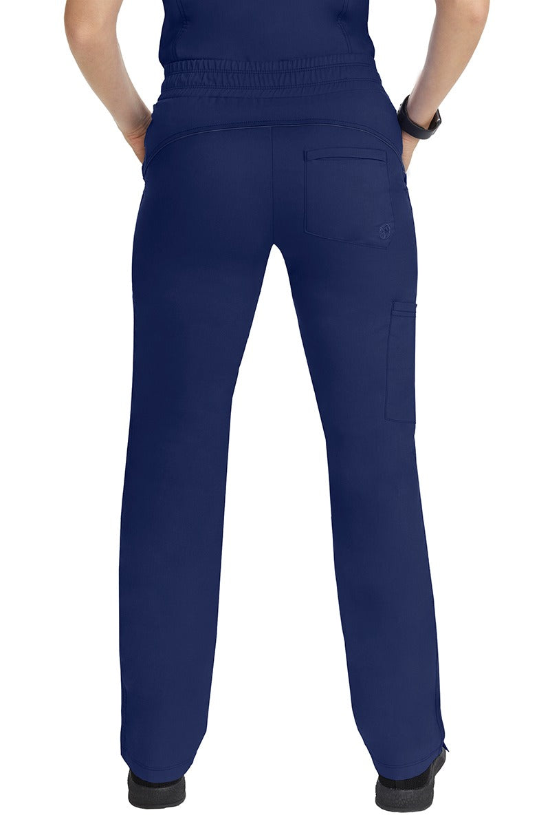 A female healthcare worker wearing a pair of Purple Label Women's Tanya Drawstring Cargo Scrub Pants in Navy featuring 1 back patch pocket for additional on the go storage needs.