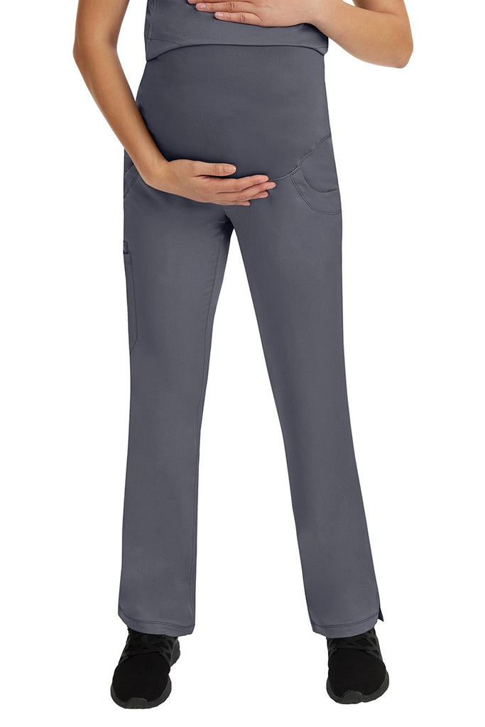 A young female LPN wearing an HH-Works Women's Rose Maternity Cargo Scrub Pant in Pewter featuring a stretch yoga waistband.