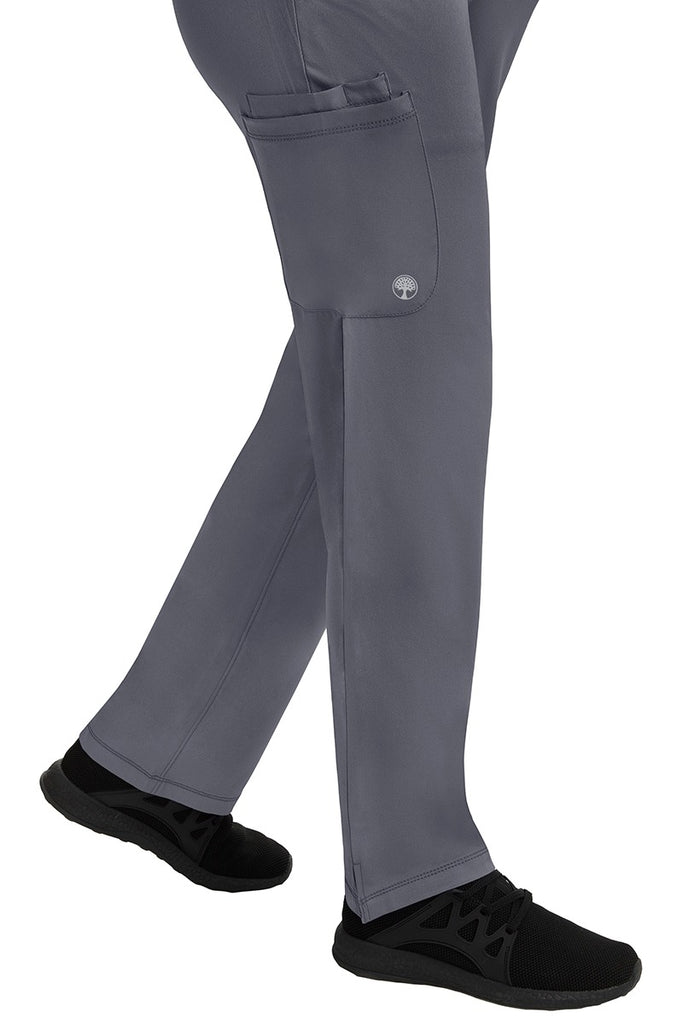 A young female healthcare professional wearing an HH-Works Women's Rose Maternity Cargo Scrub Pant in Pewter featuring a super comfortable stretch fabric made of 91% polyester & 9% spandex.