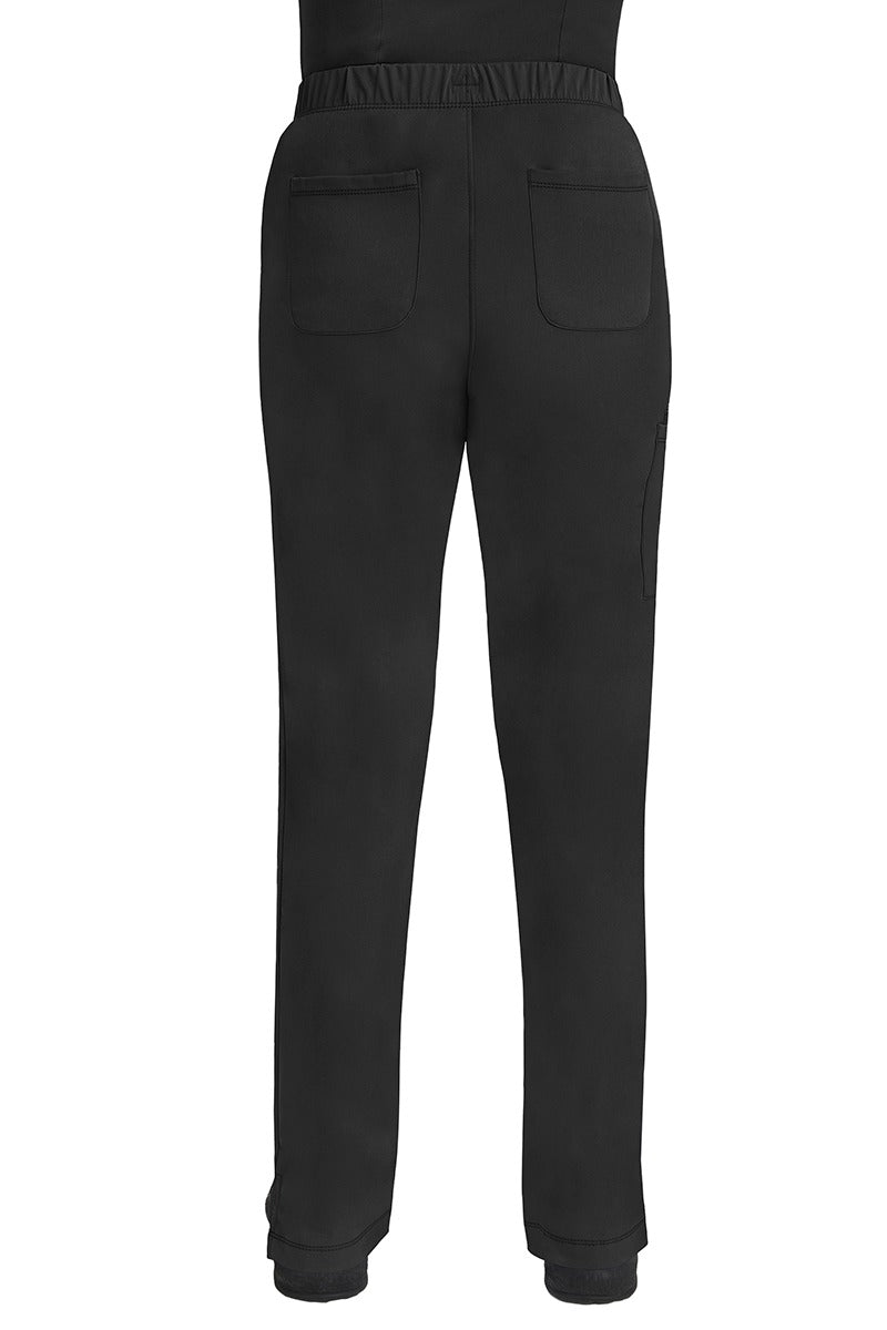 A lady CNA wearing an HH-Works Women's Rebecca Multi-Pocket Drawstring Pant in Black featuring 2 back patch pockets for any additional on the job storage needs.