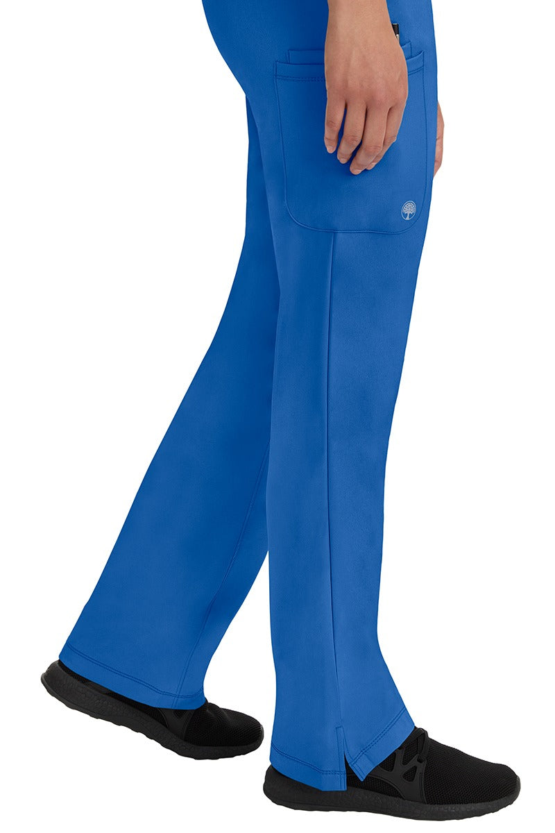 A young woman wearing an HH-Works Women's Rebecca Multi-Pocket Drawstring Pant in Royal. Perfect for Healthcare Professionals working in Hospitals or as Physical Therapists, Optometrists, & Chiropractors!