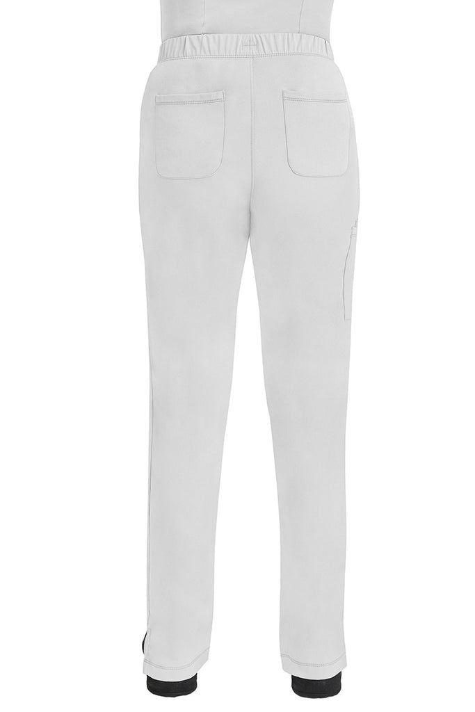 A lady CNA wearing an HH-Works Women's Rebecca Multi-Pocket Drawstring Pant in White featuring 2 back patch pockets for any additional on the job storage needs.