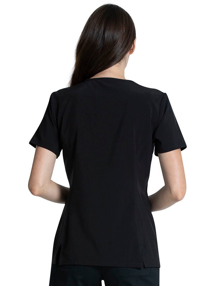 The back of the Tooniforms Women's V-neck Printed Scrub Top in "Forest Frolic" featuring a center back length of 25.5".