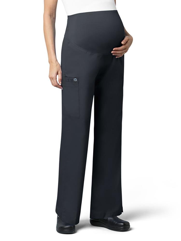A female Audiologist wearing a pair of WonderWork Women's Maternity Cargo Scrub Pant in pewter size medium featuring flare leg styling.